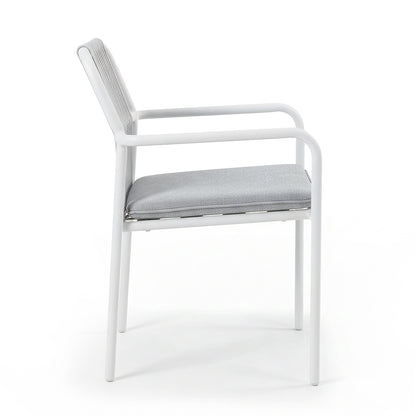 Evone 4 Seater Stone Outdoor Dining Table Set in Light Grey features a sleek stone tabletop and sturdy white metal frame, complemented by light gray upholstered chairs, perfect for stylish outdoor dining.