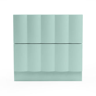 Mint green chest of drawers with wavy geometric front on white background