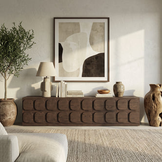 Dark wood sideboard styled in a modern living room