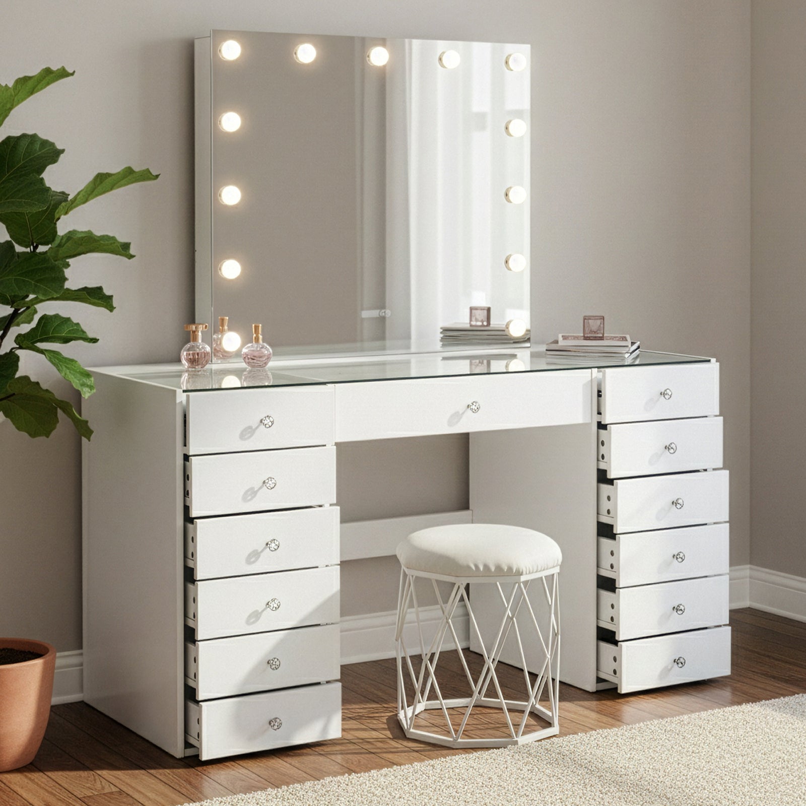Vanity table with illuminated mirror in a styled room setting