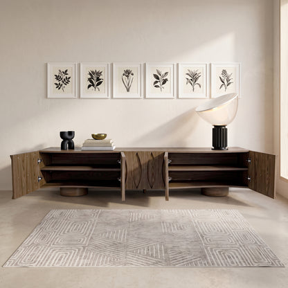 Modern wooden sideboard with open doors in a styled room