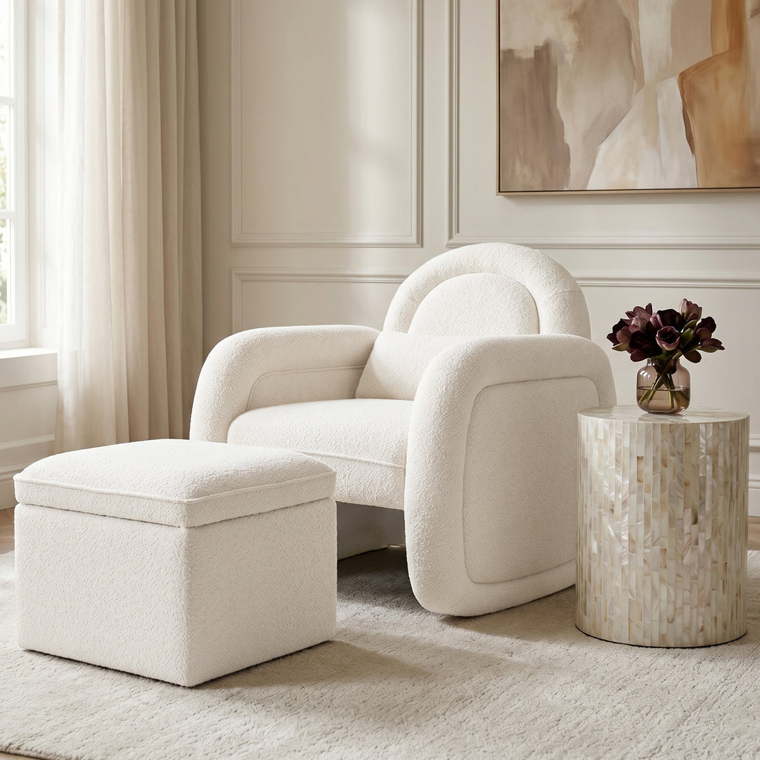 Cream-colored armchair and ottoman in a styled living room setting