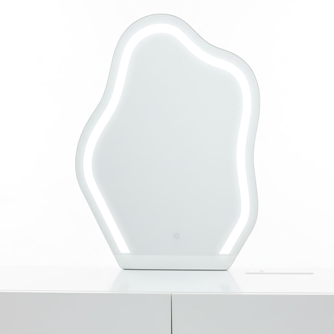 Eloura LED Mirror Dressing Table with Storage in White features an amoeba-shaped LED mirror on a sleek cabinet, showcasing modern elegance and functionality for a luxe makeup routine.