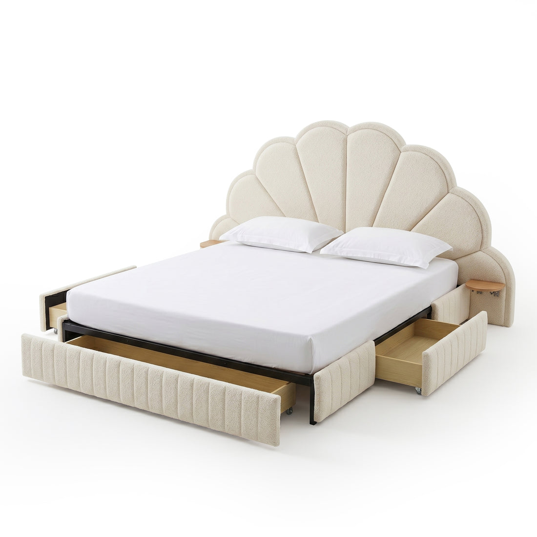 Full view of upholstered bed with scalloped headboard and open drawers on white background