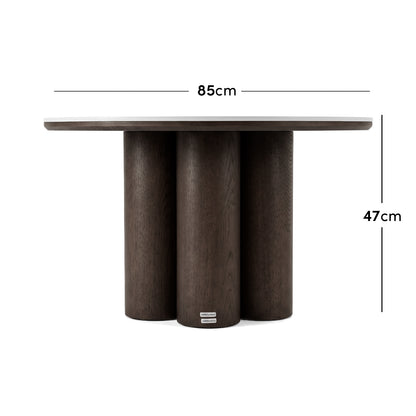 Dark wood round table with measurements shown as 85 cm wide and 47 cm high