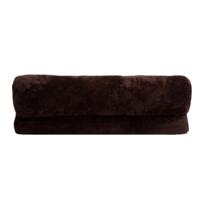 Dark brown rolled plush blanket on white background