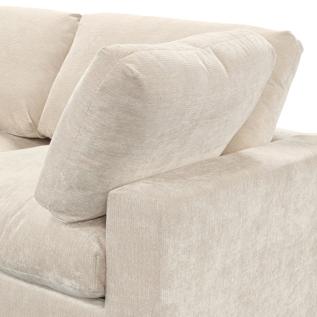 Close-up of beige sofa corner and cushions on white background