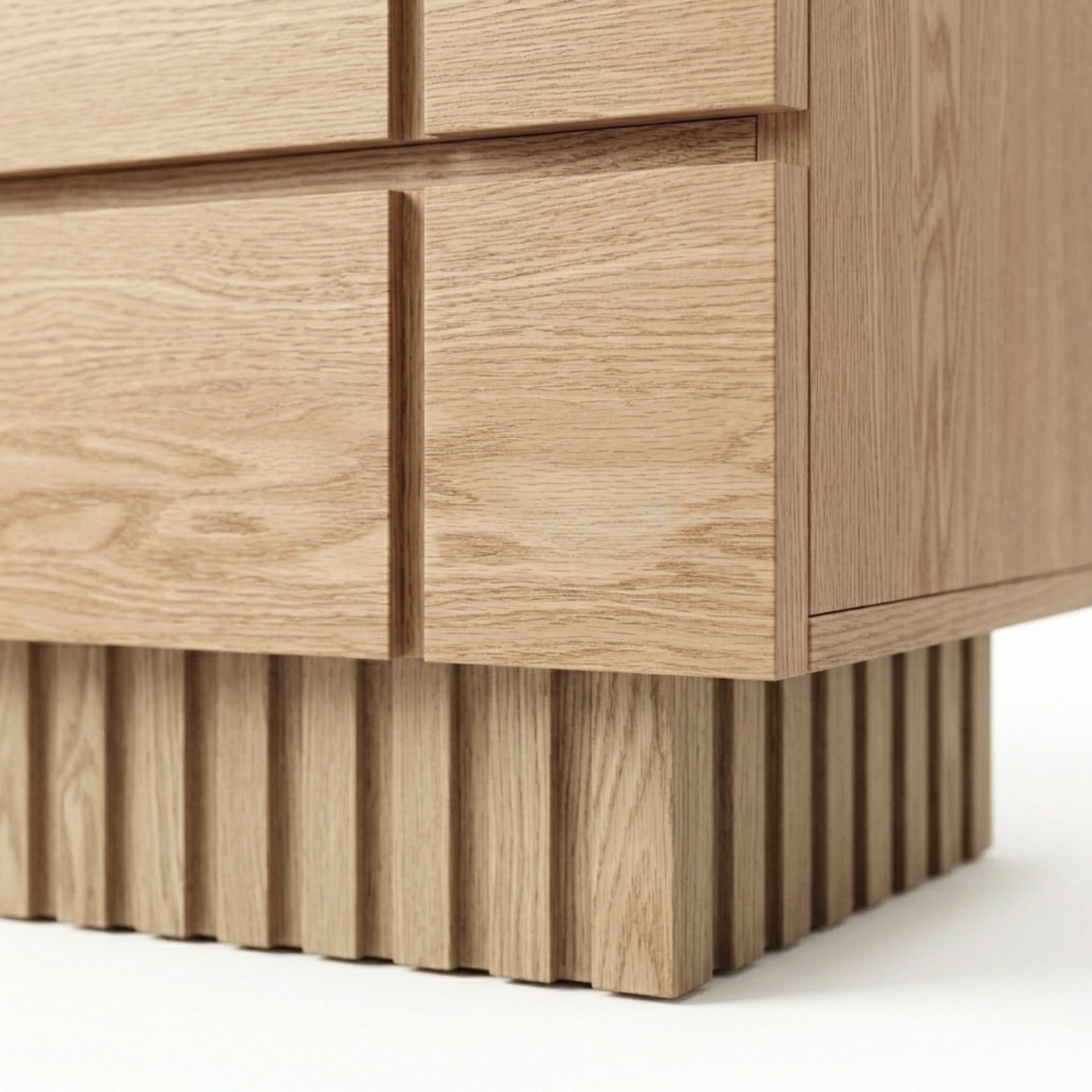 Close-up of the lower corner and fluted base of a wooden cabinet
