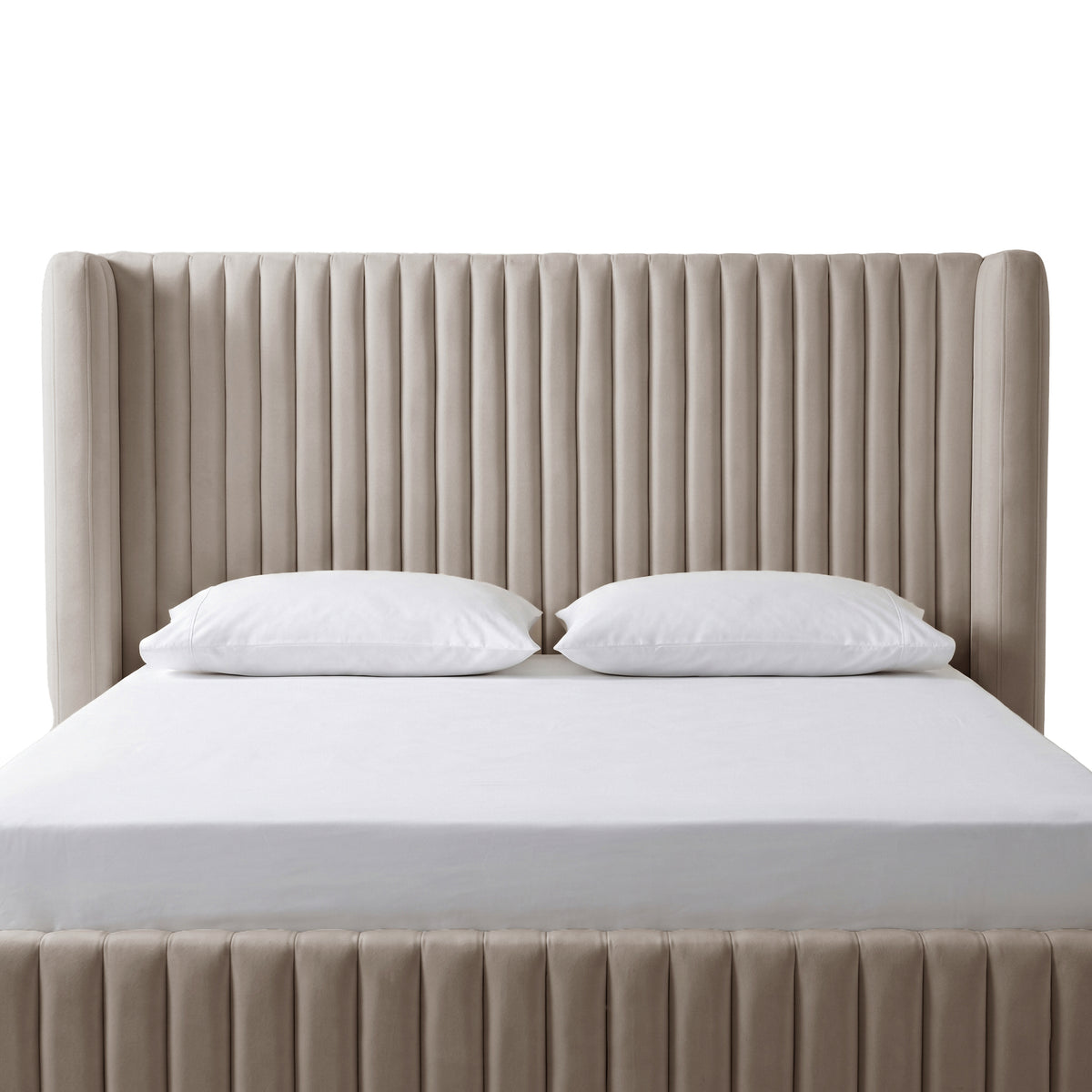 Close front view of a taupe channel-tufted upholstered bed