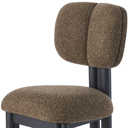 Norii Boucle Fabric Dining Chair in Rust Brown, featuring a thickly padded boucle-style upholstery and matte black metal frame, offers modern elegance and comfort, perfect for dining spaces.