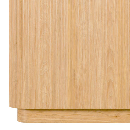 Close-up of the lower side and base of a wooden sideboard on white background