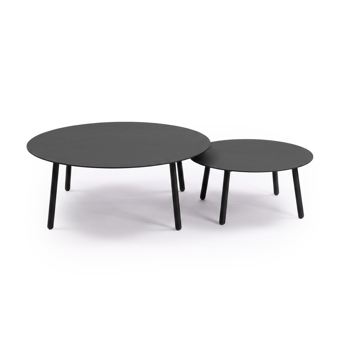 Two round black nesting tables on a white background