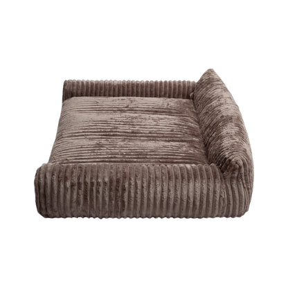 Brown corduroy pet bed with raised bolsters and lowered front entry on white background
