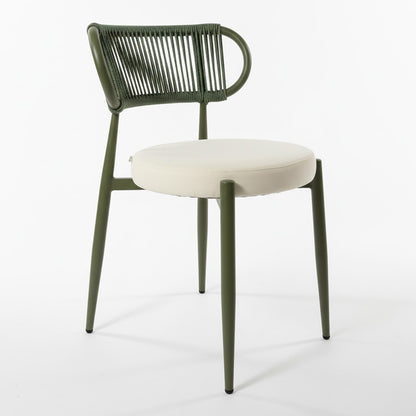 Cabria 9 Piece Sintered Stone Outdoor Dining Set in Green features modern chairs with olive green tubular metal frames, cream cushioned seats, and green rope backrests, complementing the durable sintered stone table.