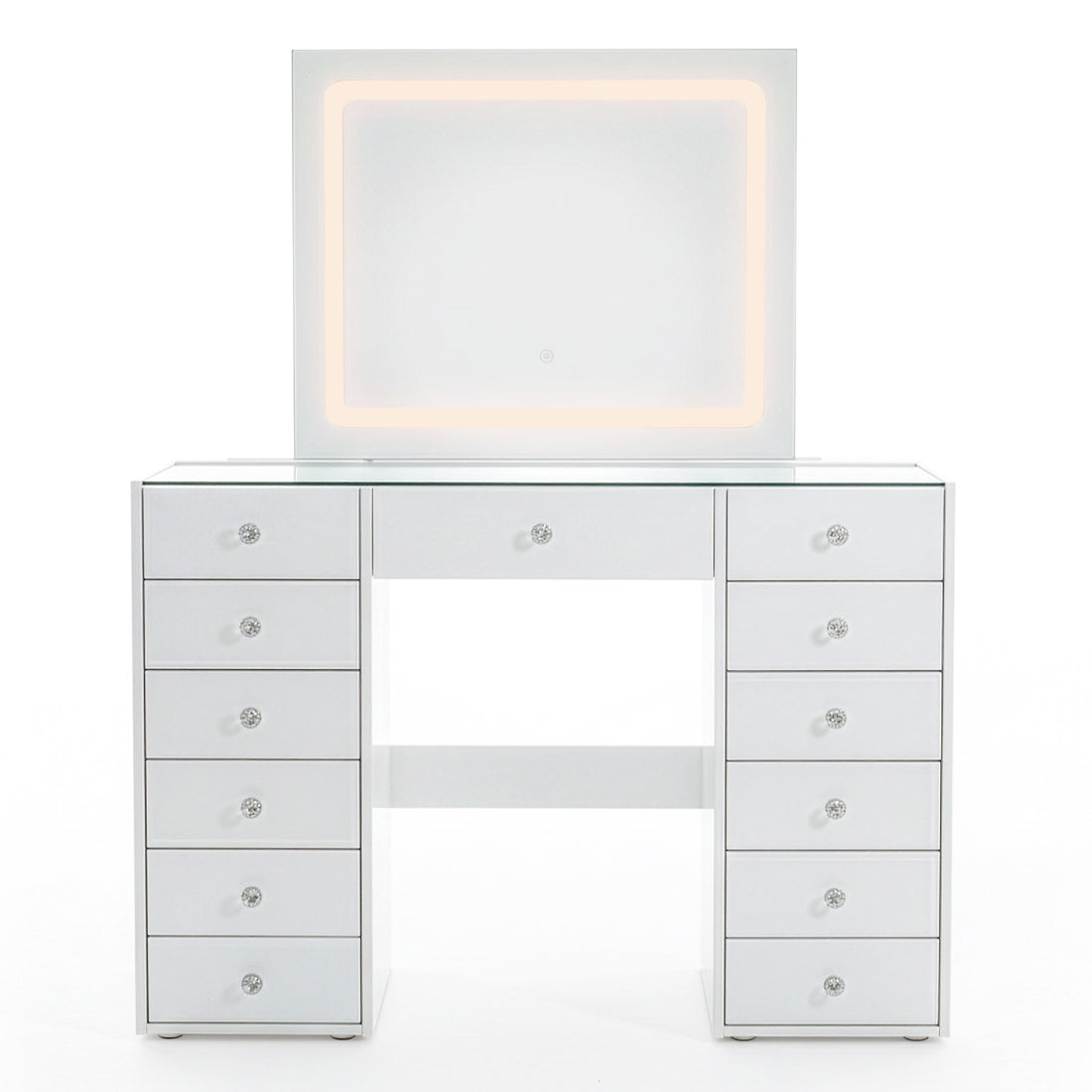 White vanity table with lit mirror and crystal drawer knobs on white background