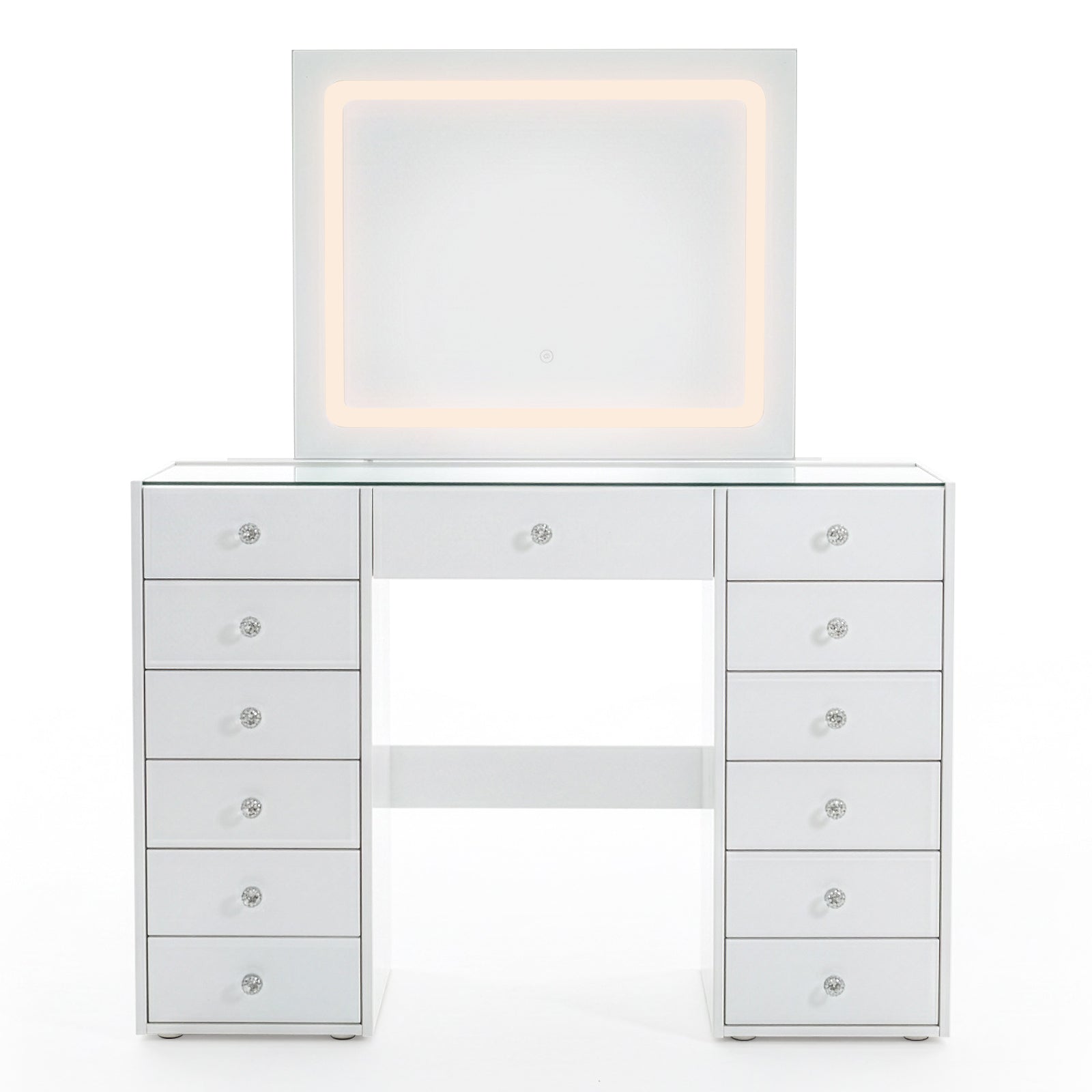 White vanity table with lit mirror and crystal drawer knobs on white background
