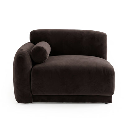 Dark brown upholstered lounge chair with bolster pillow on white background