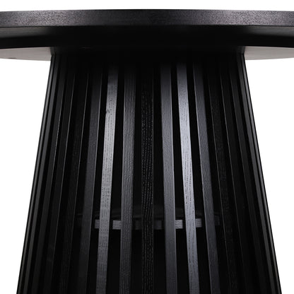 Close-up of the Riri 120cm Round Fluted Wood Dining Table in Black, showcasing its round tabletop and sculptural fluted cone base with vertical slats, highlighting its modern, space-saving design.
