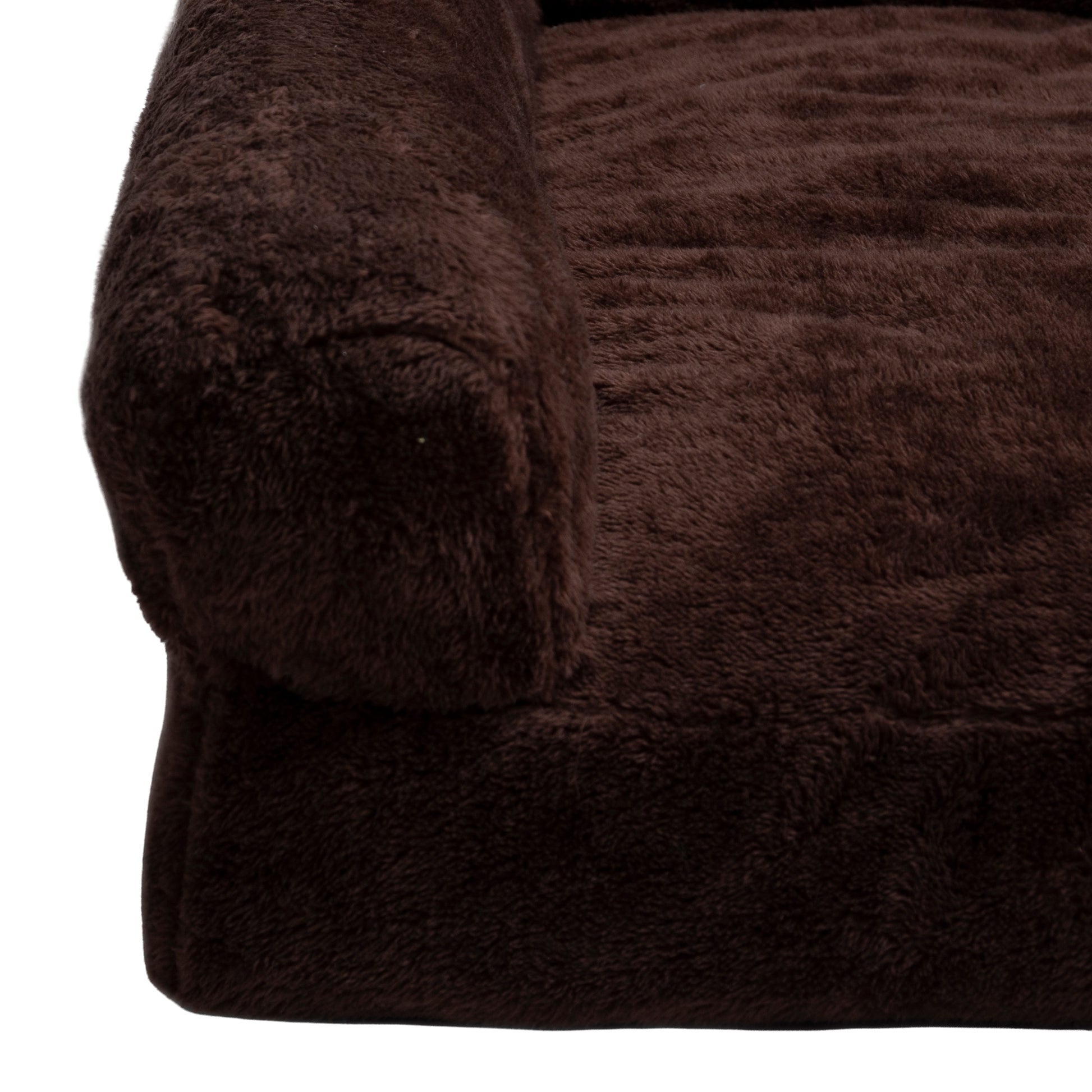 Close-up of plush brown fabric corner on white background