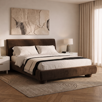 Upholstered dark brown bed styled in a cozy bedroom with nightstands and lamps