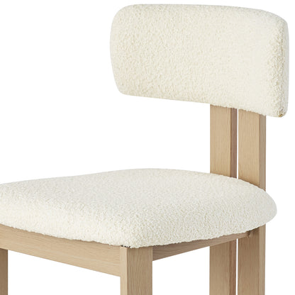 Haleo Curved Boucle Dining Chair Set of 2 in Cream White features a light-wood frame, softly upholstered, textured boucle-style fabric, a low backrest, and sturdy metal legs for modern elegance and comfort.