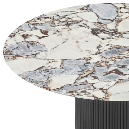 Gracie 120cm Round Marble Dining Table in Black features a white marble tabletop with unique gray and brown veining, set on a vertically ribbed, black cylindrical base, showcasing luxury and elegance.