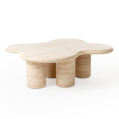 Cloud-shaped travertine coffee table on white background, full view