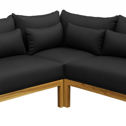 Tavi 5 Seater Solid Timber L Shape Outdoor Sofa with light-stained wooden frame, thick black cushions, arranged in an L-shape, showcasing sturdy acacia timber and woven rope detail for outdoor comfort.