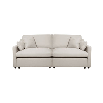 Light beige modern sofa with cushions on a white background