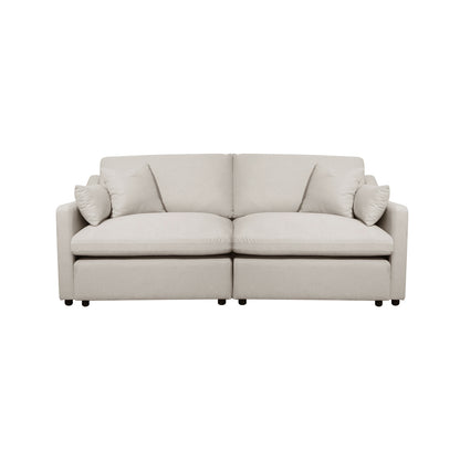 Light beige modern sofa with cushions on a white background