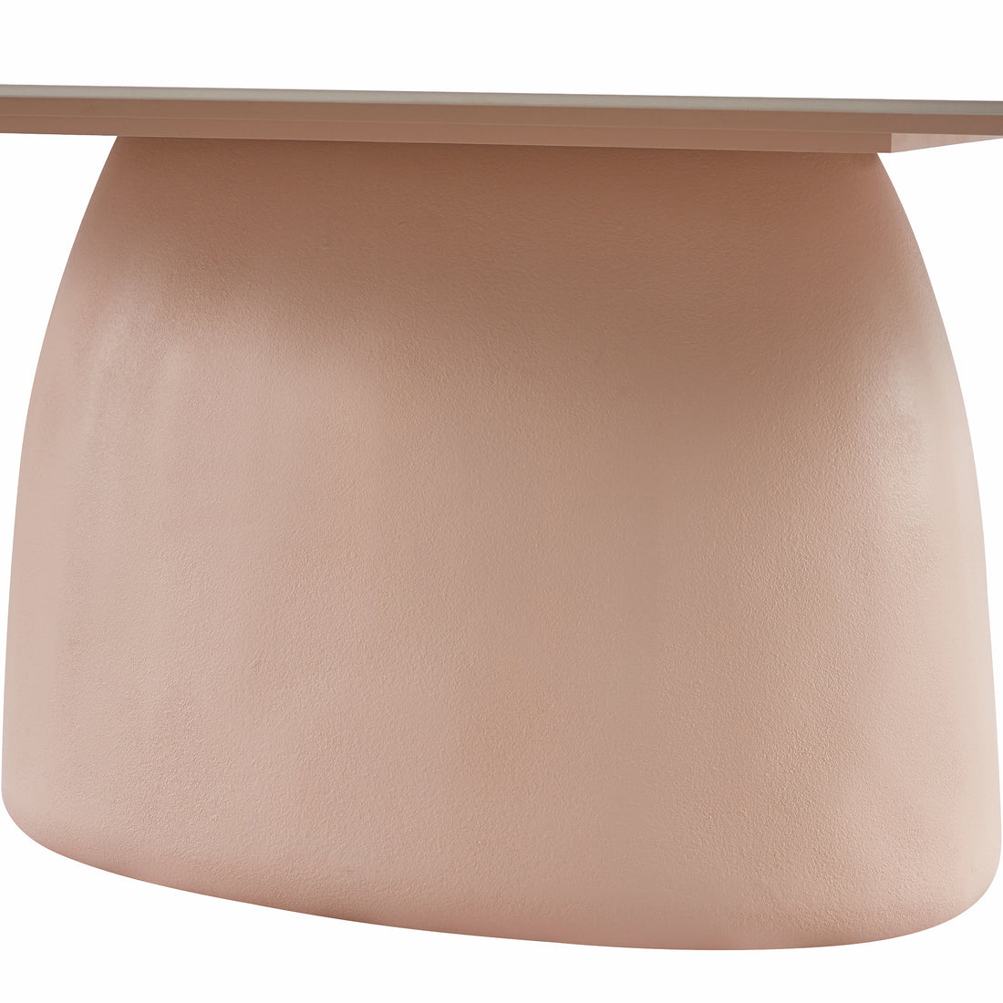 Close-up of blush pink sculptural table base with a small portion of the tabletop