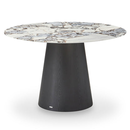 Dina 120cm Round Marble Dining Table features a white marble top with gray and brown veins, supported by a black tapered base, blending elegance and modern design for refined dining spaces.