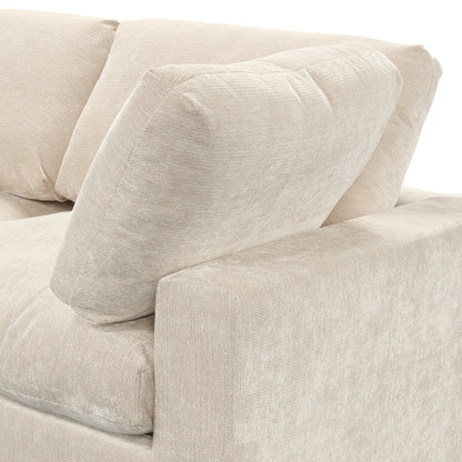 Close-up of beige sofa cushions and armrest on a white background