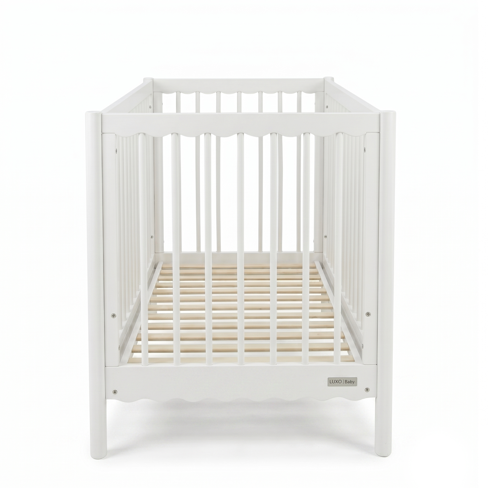 Front view of white wooden baby crib on a white background