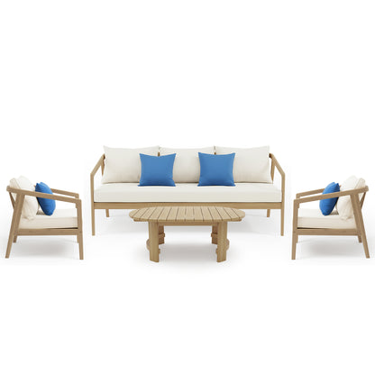 Complete patio furniture set with sofa, armchairs, coffee table and blue accent pillows on white background