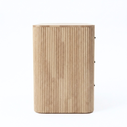 Modern wooden cabinet with rounded edges and ribbed texture on a white background