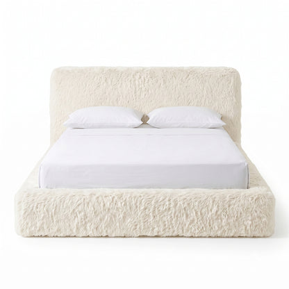 Full plush upholstered bed on a white background