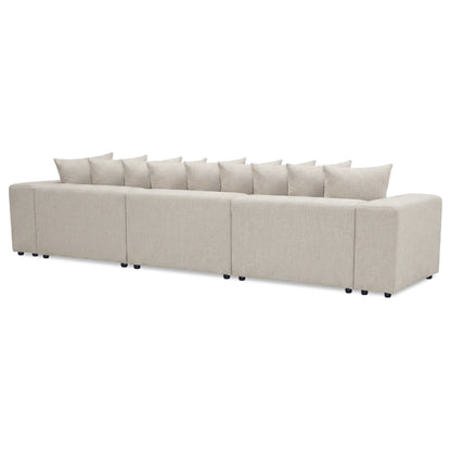 Long modular beige sectional sofa on white background