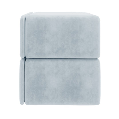 Luxo Tyla Modern Velvet Bedside Table Ice Blue, featuring two stacked pale-blue, upholstered cubic ottoman blocks, showcasing its plush velvet texture and compact, stylish design against a plain backdrop.