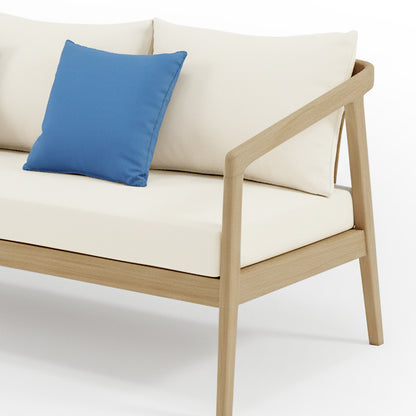 Delva 4 Seater Hardwood Acacia Outdoor Sofa Set in Cream, featuring a minimalist two-seat sofa with a light wood frame, cream upholstery, and a blue throw pillow, shot against a white background.