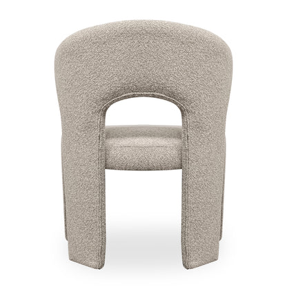 Lunari Bouclé Curved Accent Chair in Beige, showcasing a modern rear view with a curved backrest, split legs, and a cut-out design, upholstered in textured bouclé fabric.
