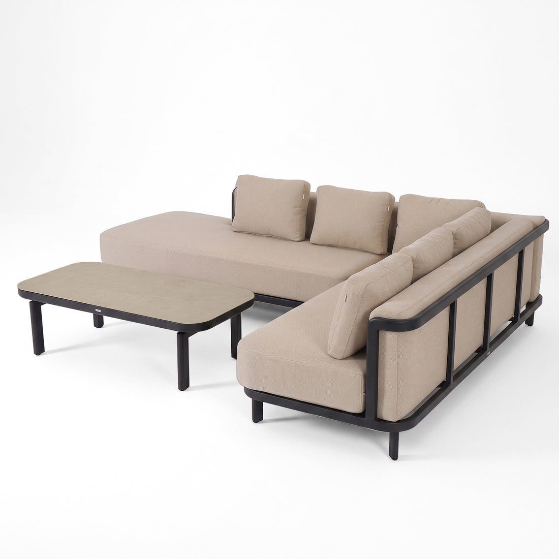 Beige sectional sofa with matching coffee table on white background.