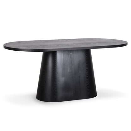 Gigi 180cm Oval Wooden Dining Table in Black features a dark-stained oval top with a sculptural pedestal base, offering a modern, elegant look ideal for enhancing dining spaces with style and functionality.