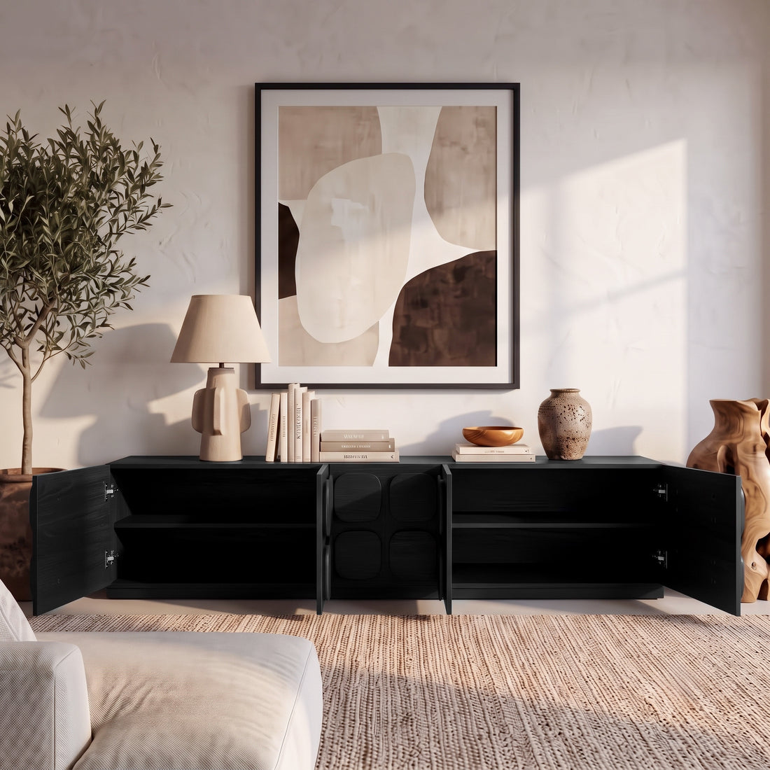 Black sideboard with open doors styled in a contemporary living room