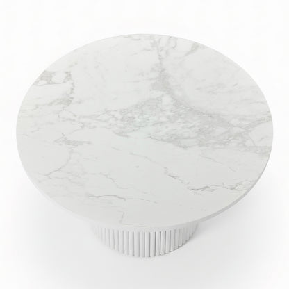 Evone Aluminium Outdoor Dining Table in White, featuring a round marble-effect tabletop with light gray veining, supported by a matching fluted pedestal base, designed for stylish and durable outdoor use.