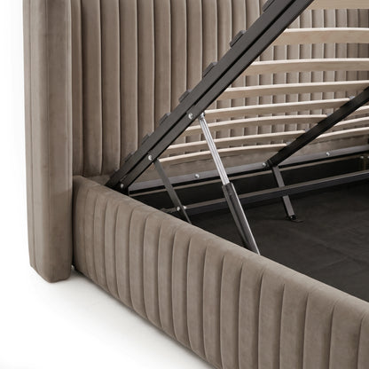 Close-up of upholstered storage bed lift mechanism and wooden slats