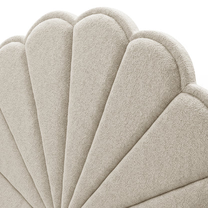 Close-up view of textured scalloped upholstered headboard fabric and stitching on white background
