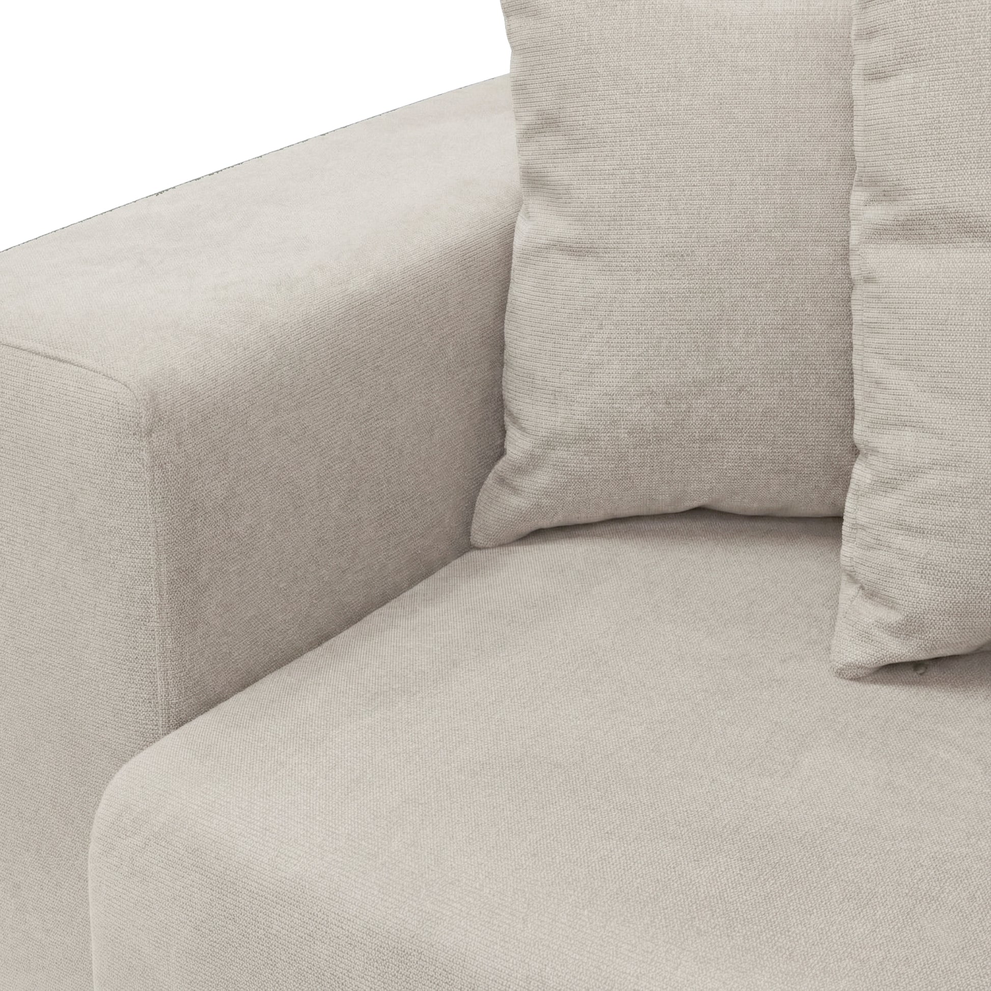 Close-up corner of beige sofa with cushion on white background