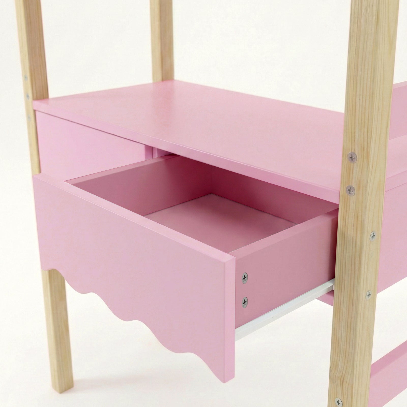 Open pink drawer with natural wood legs on white background