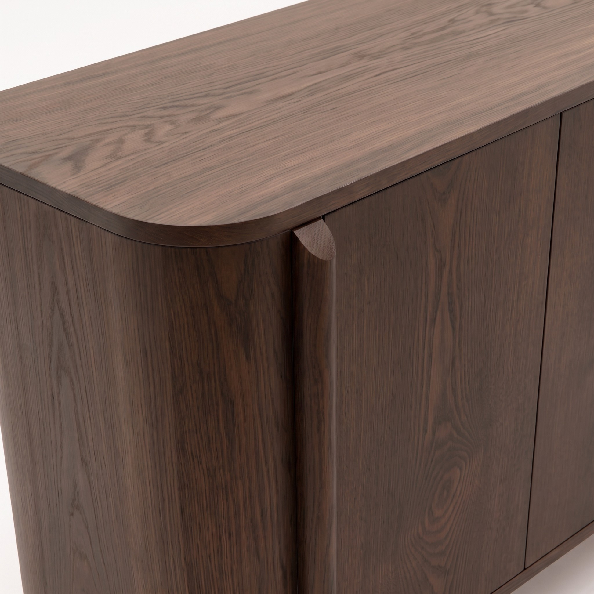 Close-up of dark wood cabinet corner and top on white background